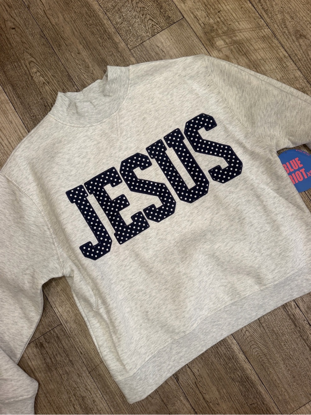 Gray Mock neck sweater with 'JESUS' polka dot Script